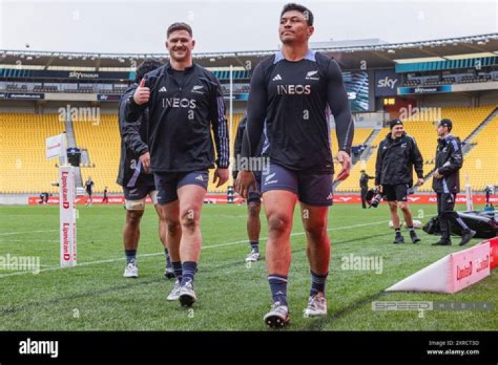 Dalton Papali'i and Rieko Ioane celebrate a try against England.